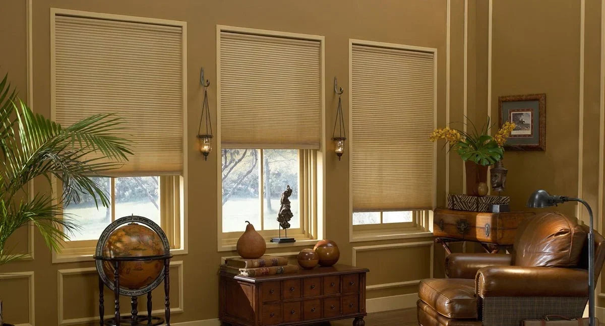 Cordless accordion blinds for windows in an elegant living room featuring horizontal cellular honeycomb pleats
