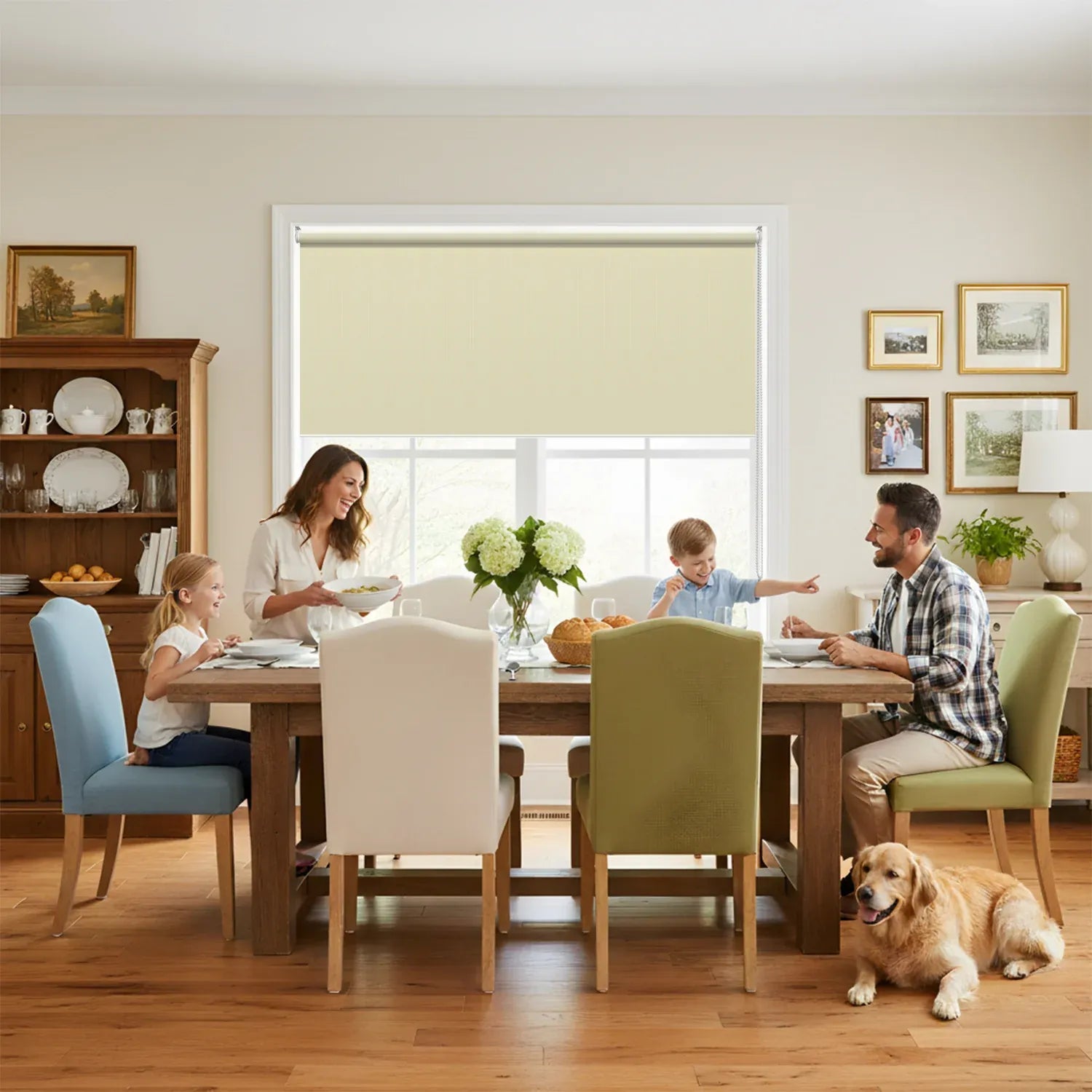 Cordless light filtering roller shade in beige installed in a family dining room — UAM Blinds