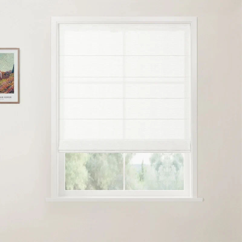 White flat fold linen roman shade partially raised on a window — clean horizontal pleats, cordless, natural light filtering through fabric
