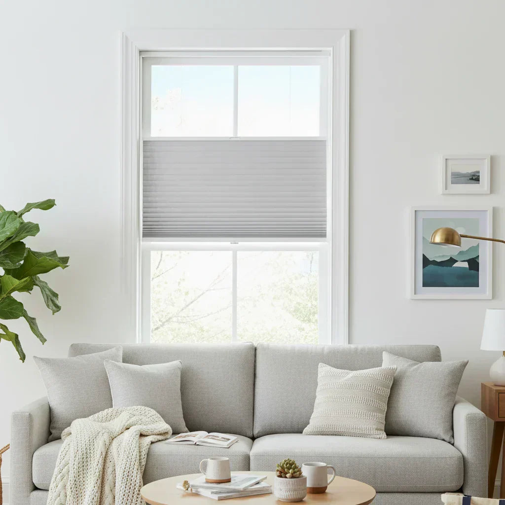 Cellular shades installed in a modern living room showing top-down bottom-up light control — UAM Blinds