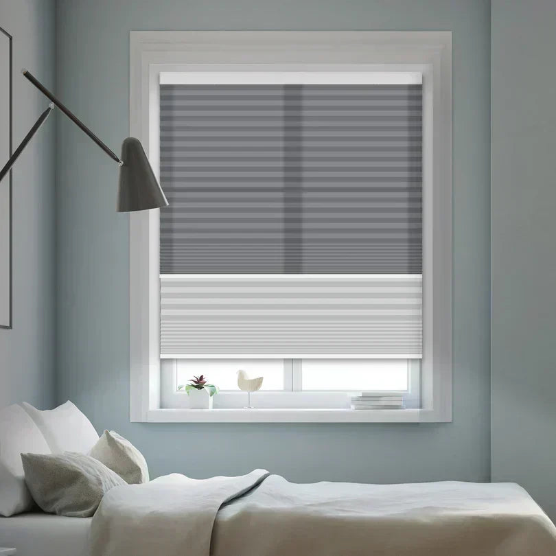 UAM Blinds custom honeycomb cellular shades installed on living room windows — energy efficient window treatment for heat and cold insulation