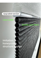 Cordless double cell cellular shades raised showing clean honeycomb folds — room darkening and light filtering custom window blinds
