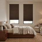 Cordless blackout cellular shades installed on dual bedroom windows blocking direct sunlight for room darkening
