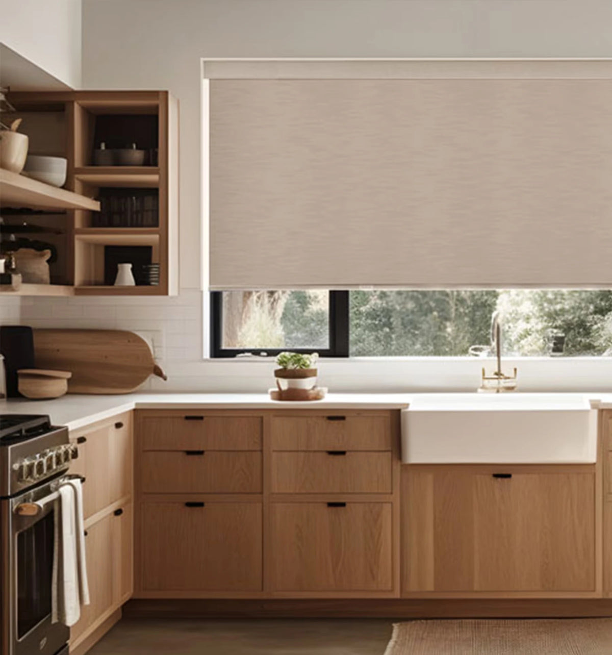 Cordless easy-clean blackout roller shade installed above a farmhouse sink in a modern kitchen with wood cabinets
