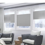 Grey TDBU top-down bottom-up cellular shades on three windows in modern living room, energy saving
